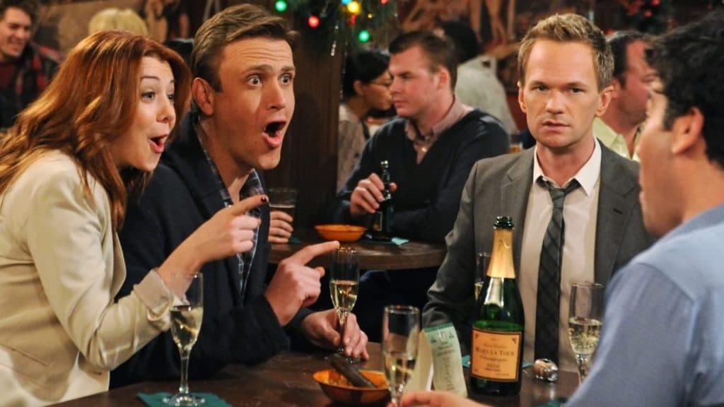 Lilly, Marshall, and Barney in How I Met Your Mother talking to Ted.