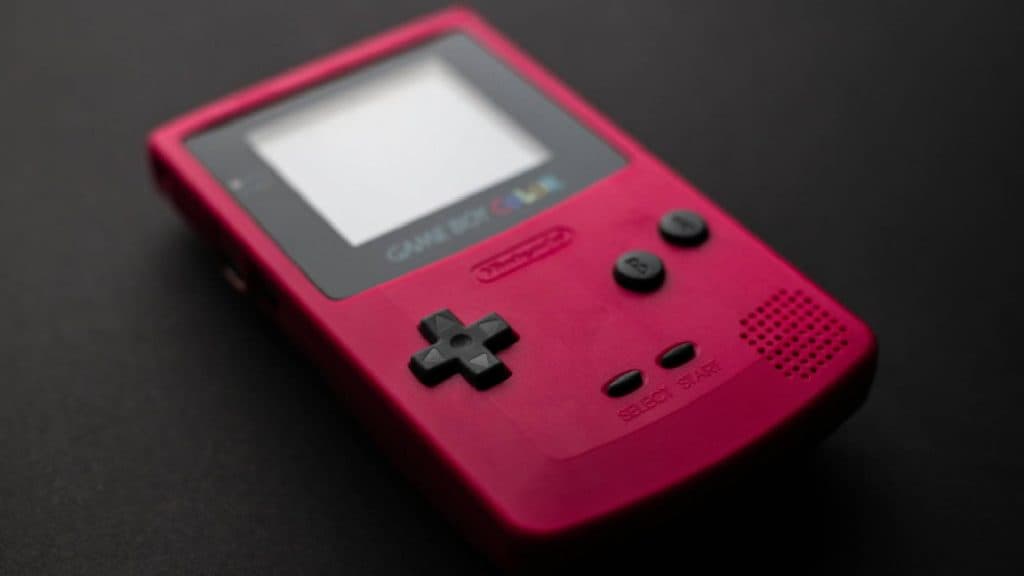 Game Boy Color in red on a black background