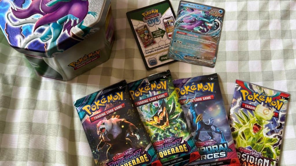 Paradox Clash Pokemon TCG Tin with Booster Packs and promo cards.