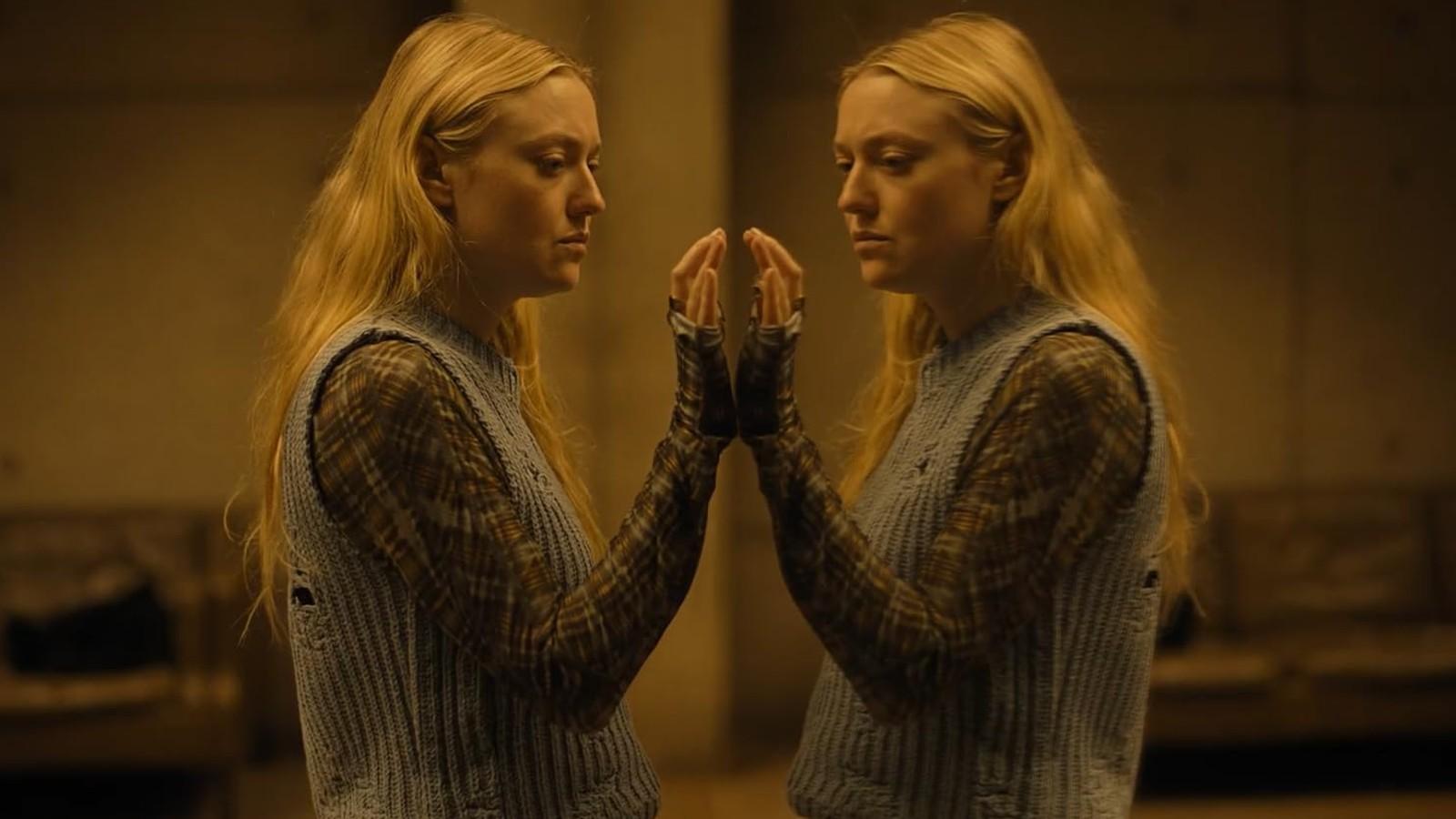 Dakota Fanning comes face-to-face with herself in a mirror in The Watcher.