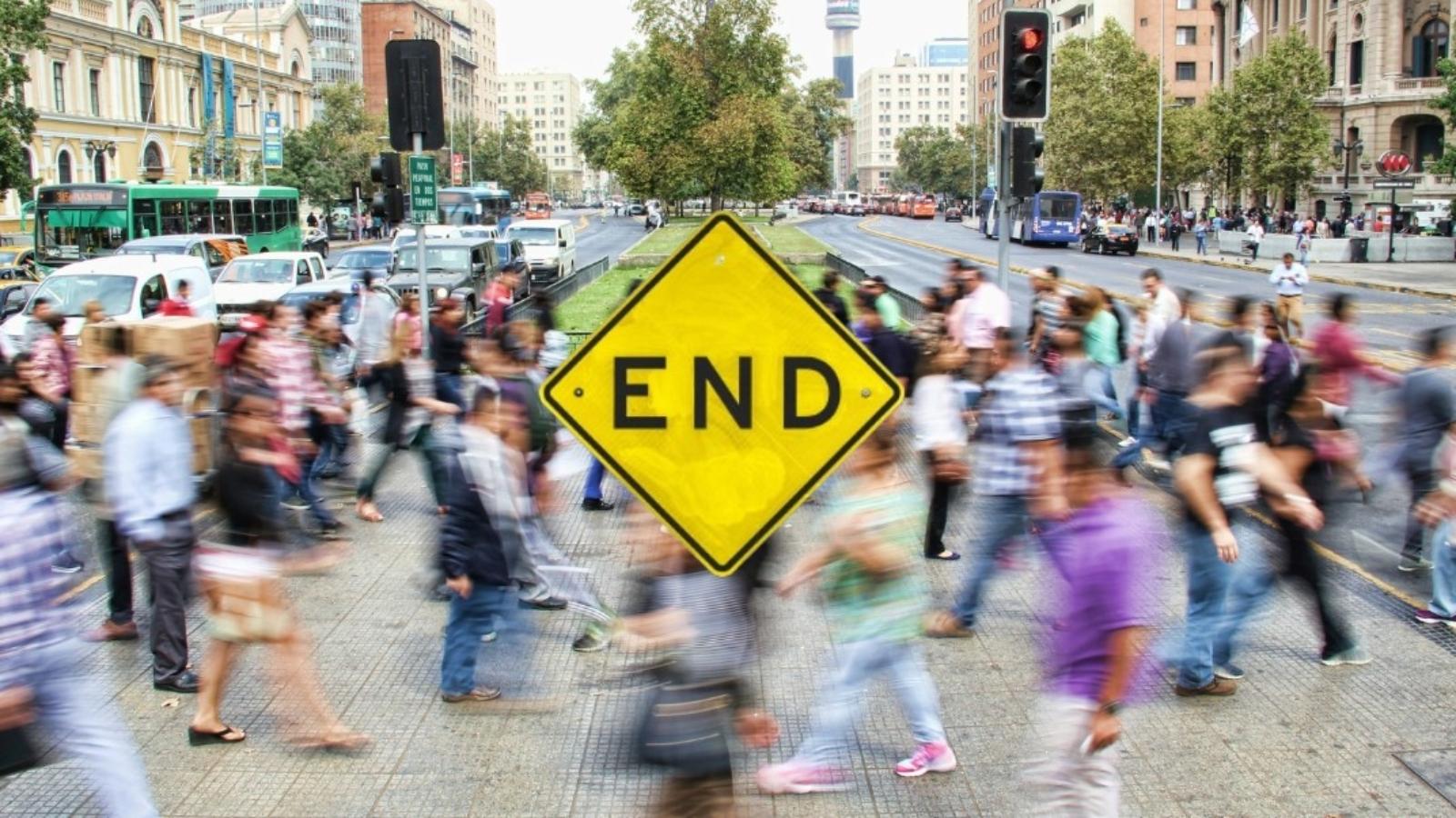 image showing end sign with a busy street in the background.