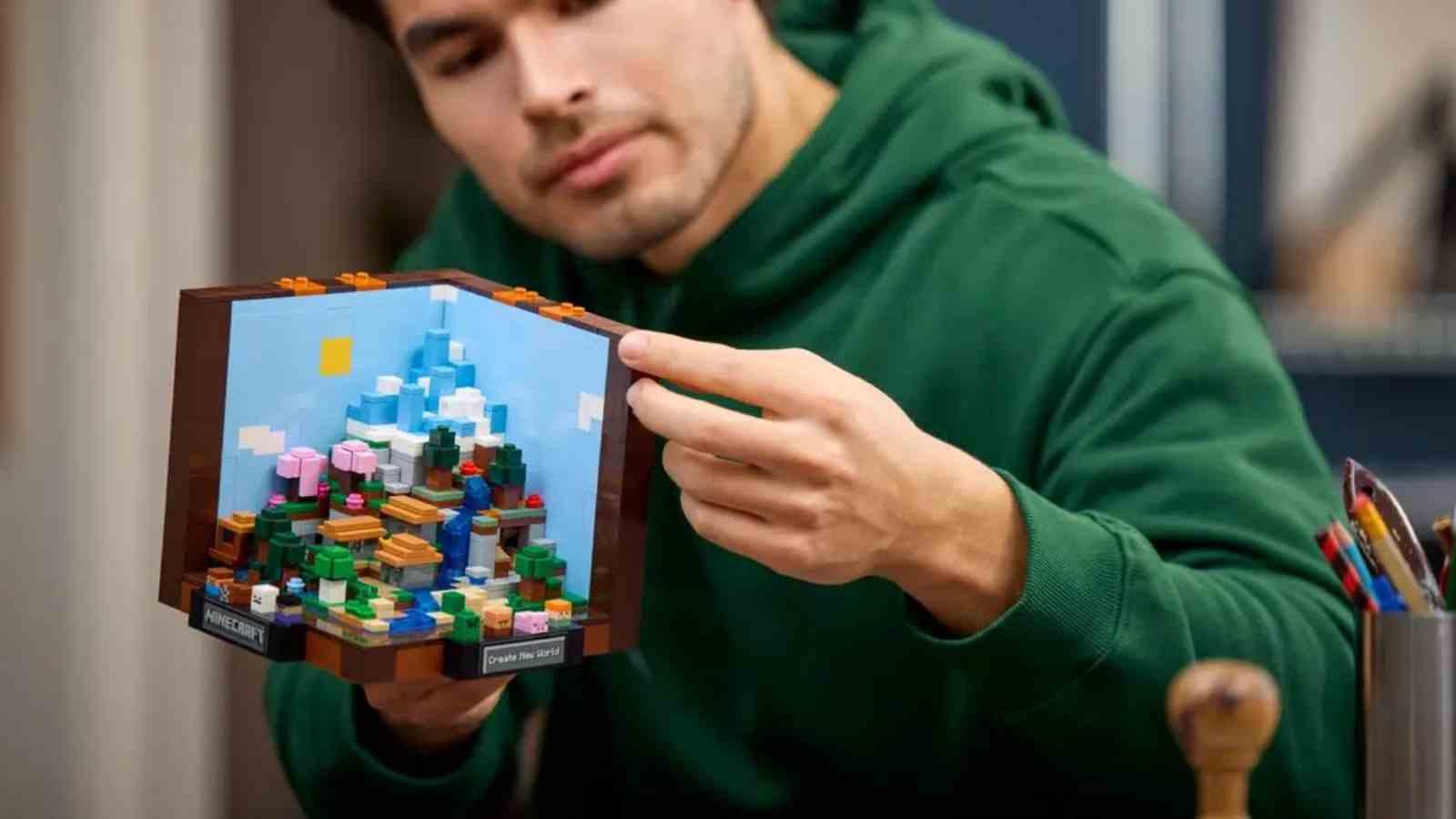 An adult with their LEGO Minecraft The Crafting Table