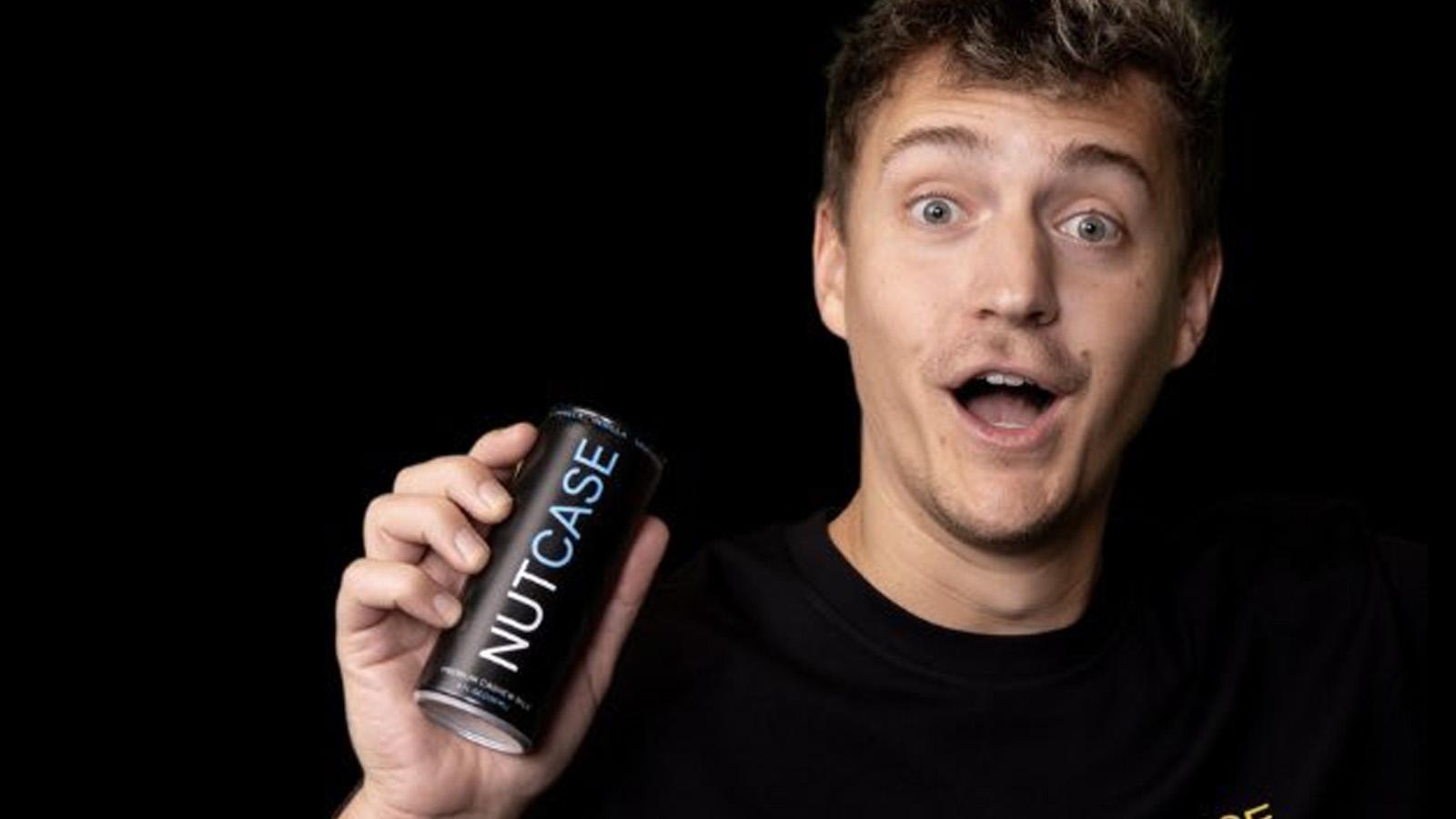 Ninja looking into the camera holding a can of nutcase