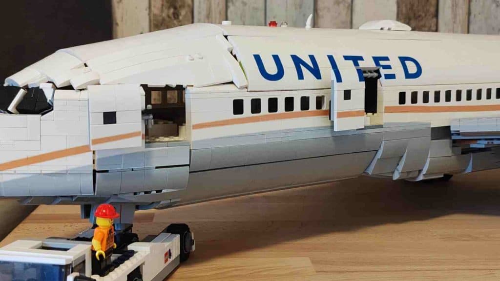 The LEGO Boeing MOC features accurate branding, opening doors, and landing gear.