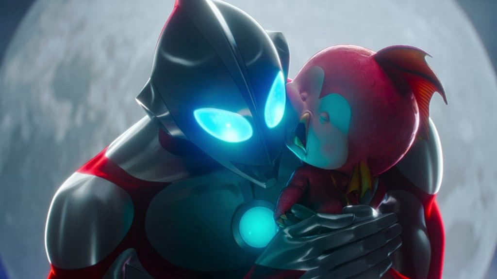 Ultraman hugs the crying Kaiju baby.