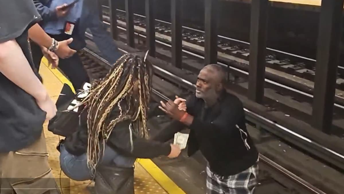 Xena helping man off train tracks