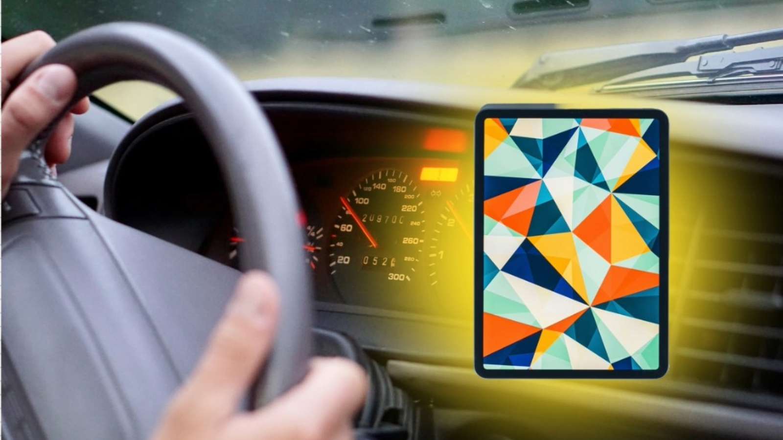 image of an iPad with a car's interior background.