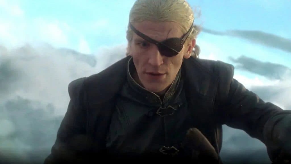 Ewan Mitchell as Aemond Targaryen in House of the Dragon, riding in the sky on the back of a dragon