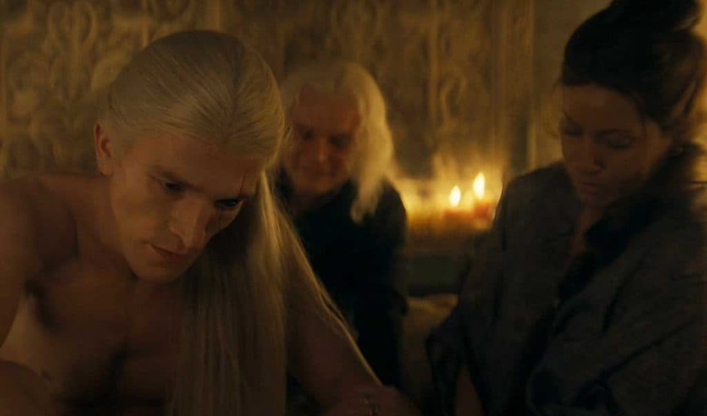 Aemond sits in the brothel with Madame while Aegon bullies him in House of the Dragon