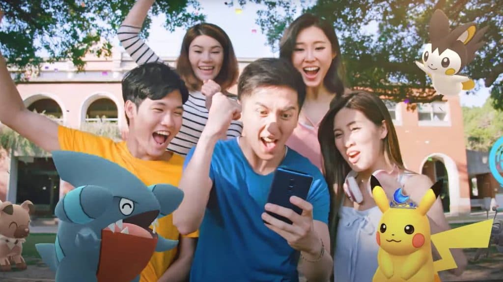 A screenshot from Pokemon Go trailer shows several people playing Pokemon Go together