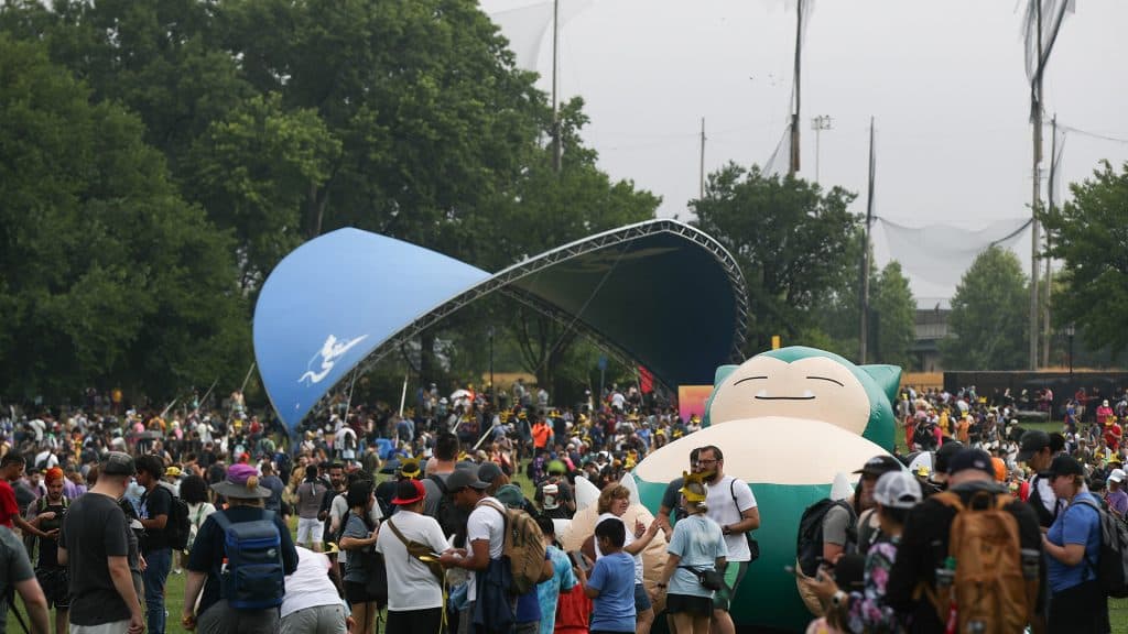 Hundreds of Pokemon Go players wander through New York City's Randall Park as part of Pokemon Go Fest