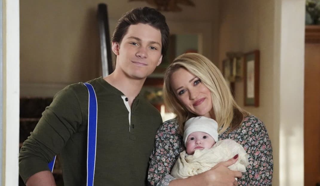 Emily Osment and Montana Jordan as Mandy and Georgie holding a baby in Young Sheldon