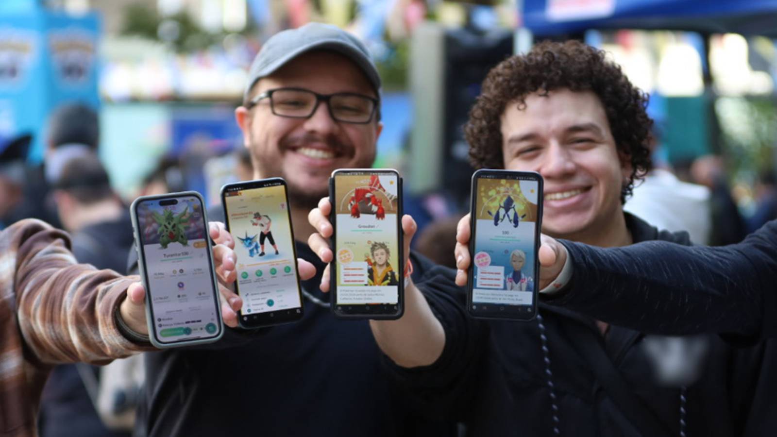 Several Pokemon Go players hold up phones
