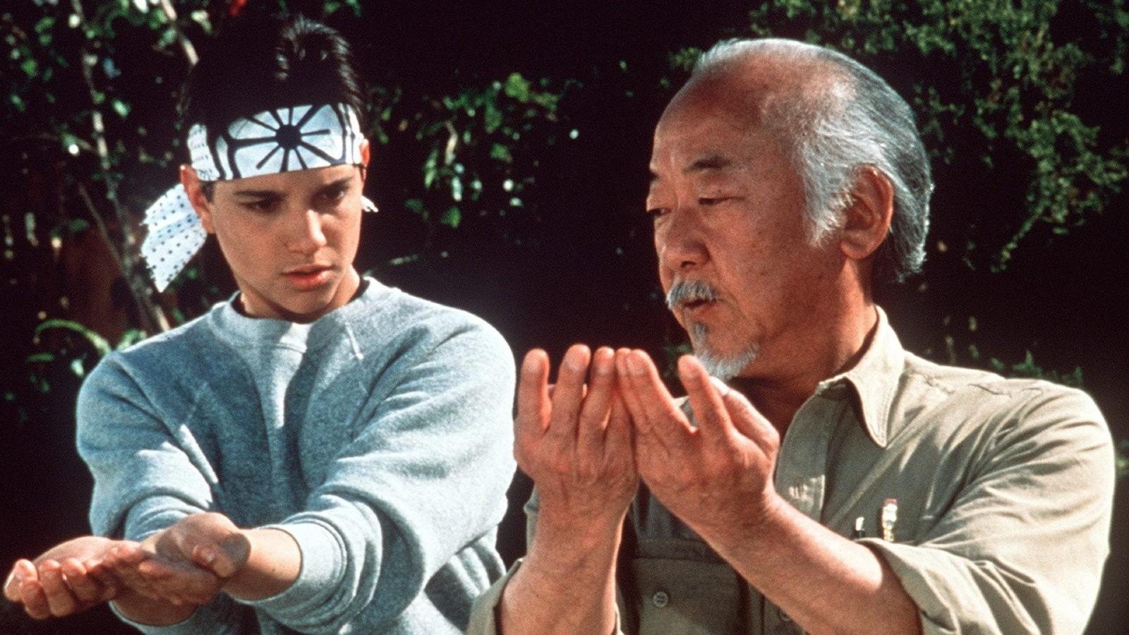 Mr. Miyagi training Daniel in The Karate Kid.