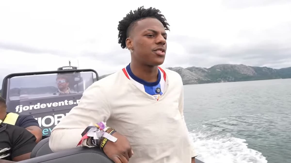 IShowSpeed wearing white shirt standing on boat