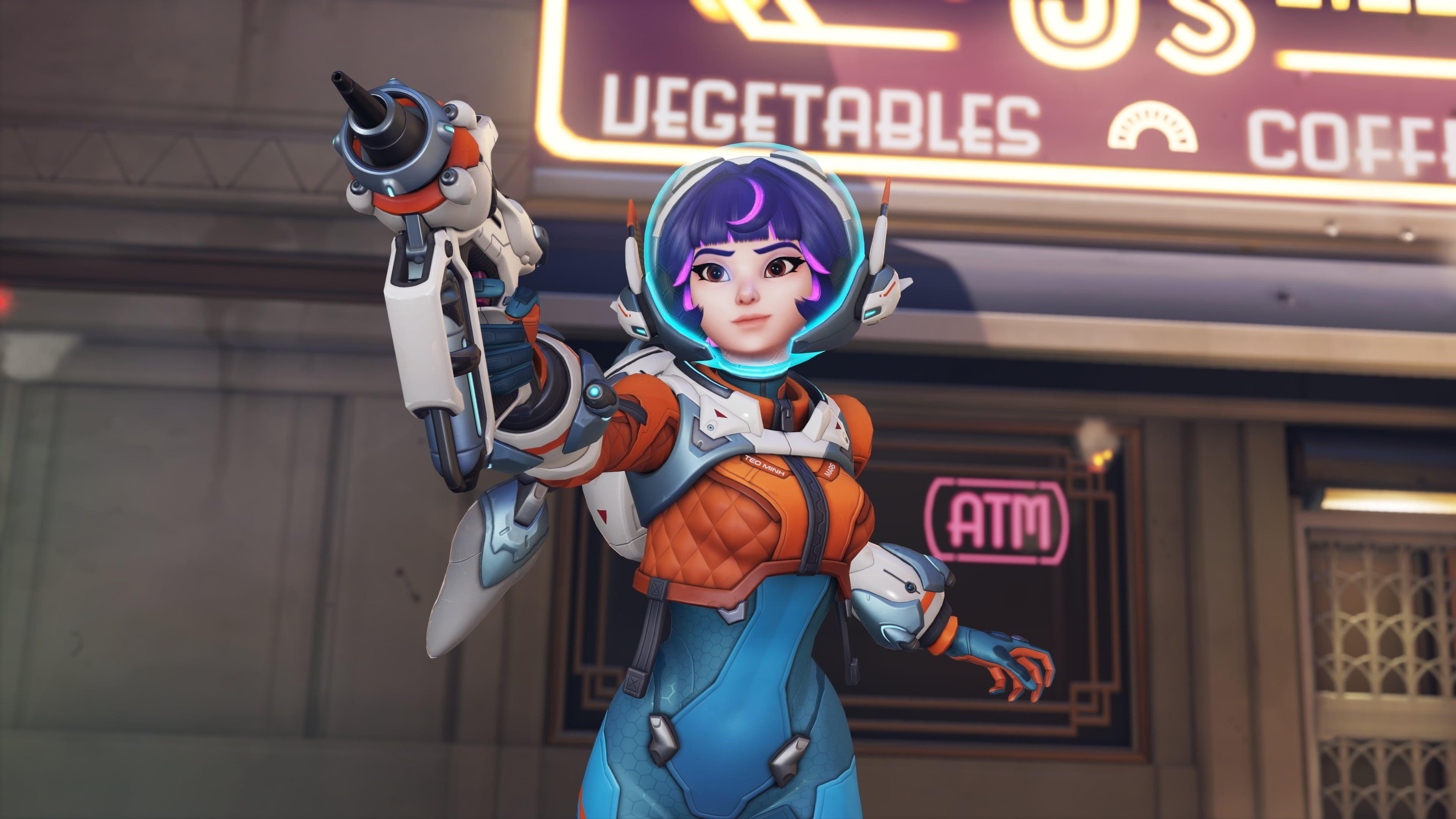 Juno stands with her mediblaster in Overwatch 2