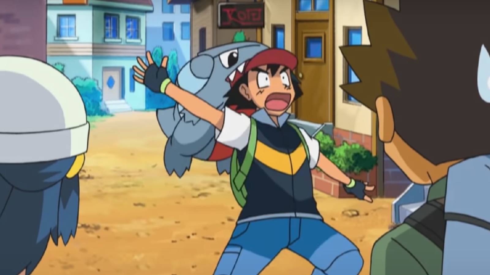 A screenshot from the Pokemon anime shows Ash ketchum being bit on the head by the Pokemon gible