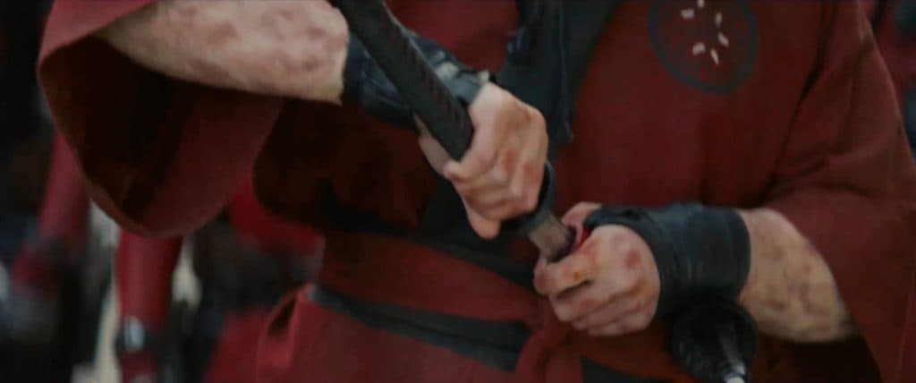 Watari Deadpool's hands holding a sword