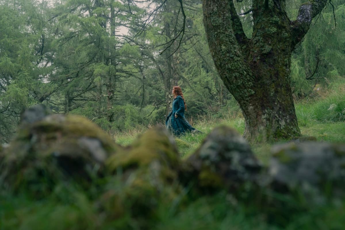 Olivia Cooke as Alicent Hightower, walking through the woods in House of the Dragon