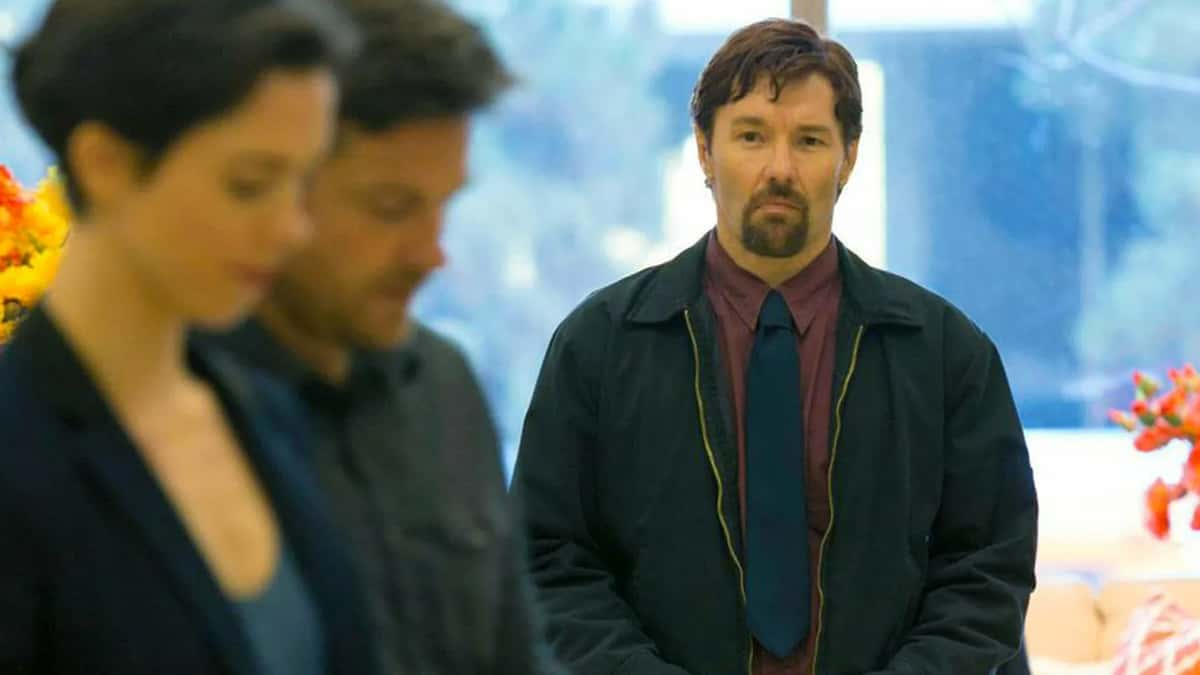 Joel Edgerton watching Jason Bateman and Rebecca Hall in The Gift.