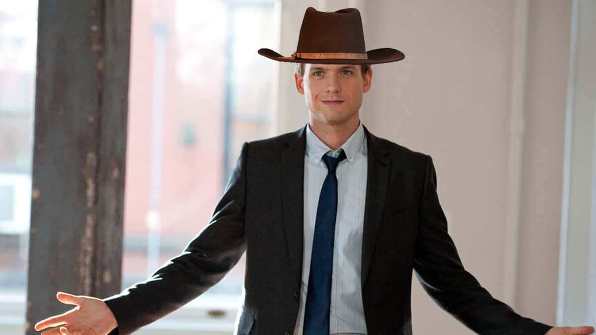 Patrick J Adams as Mike Ross in Suits, wearing a cowboy hat