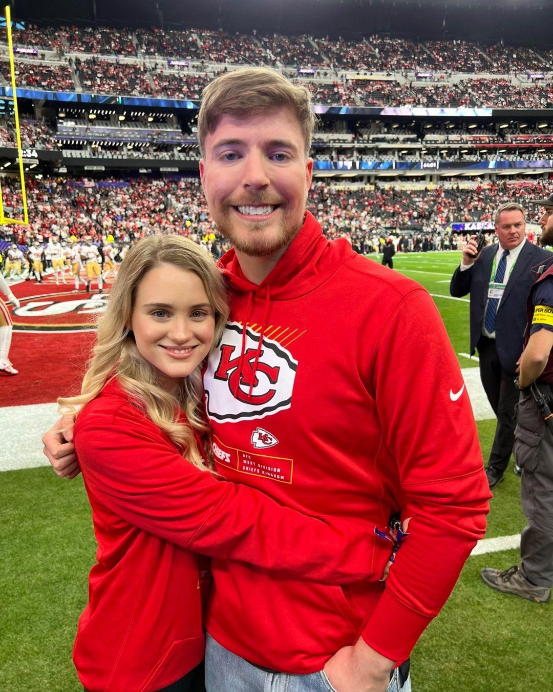 MrBeast and his girlfriend pose for a photo at the SuperBowl.