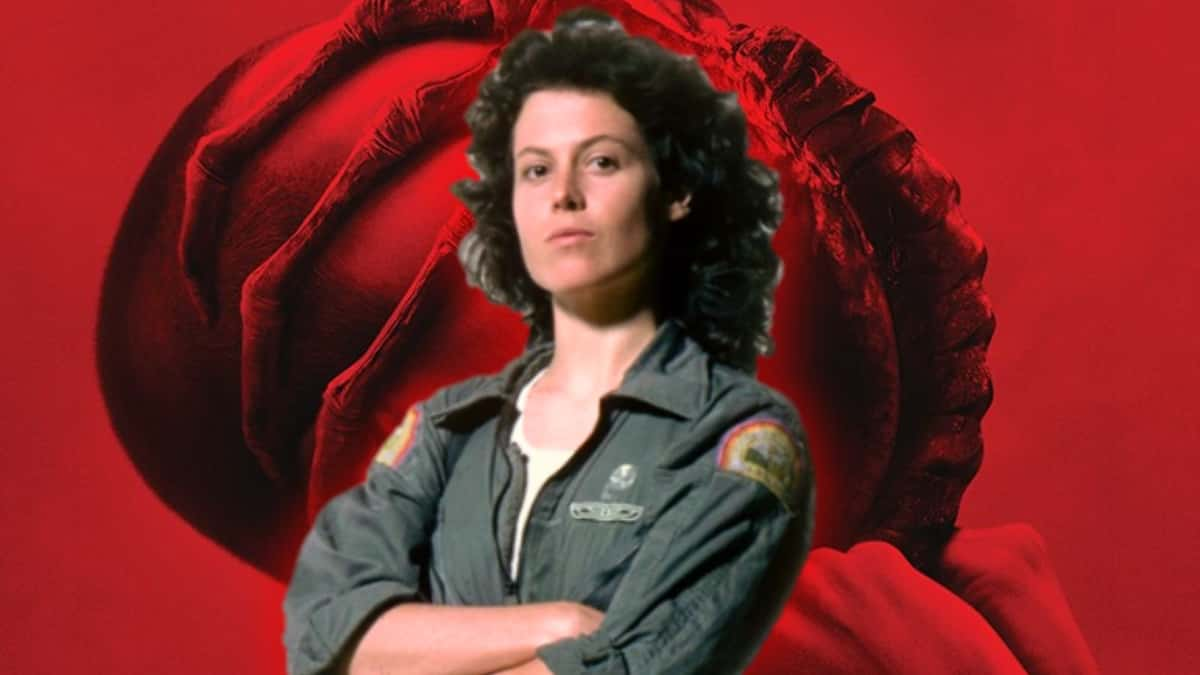 Sigourney Weaver as Ellen Ripley in front of a Alien Romulus poster.