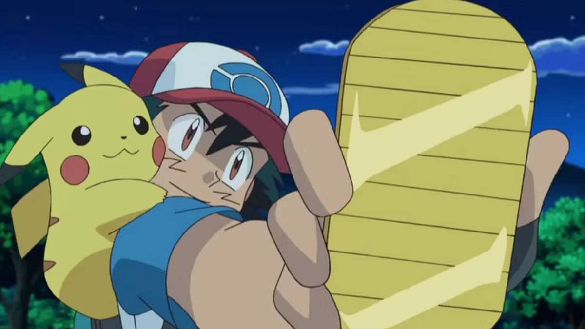 Ash Ketchum holds up a held item