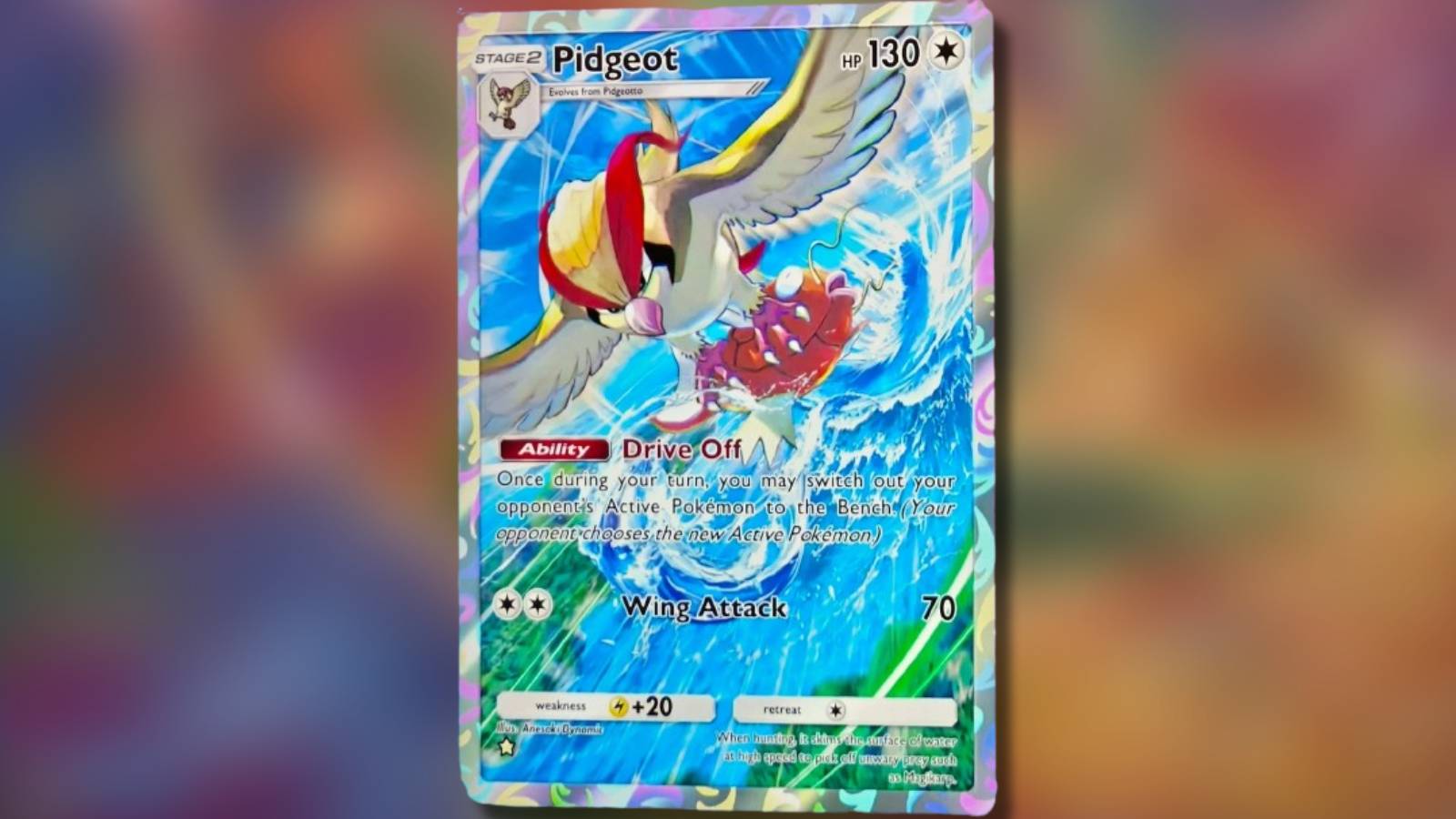 A Pokemon card is shown against a blurred background