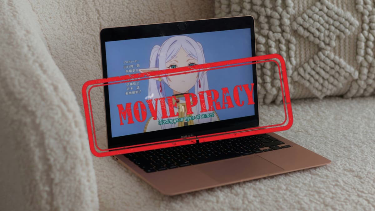 A laptop playing anime with movie piracy stamp.