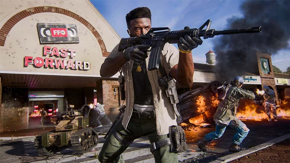 A Black Ops 6 character, holding a weapon in front of a flaming video store.