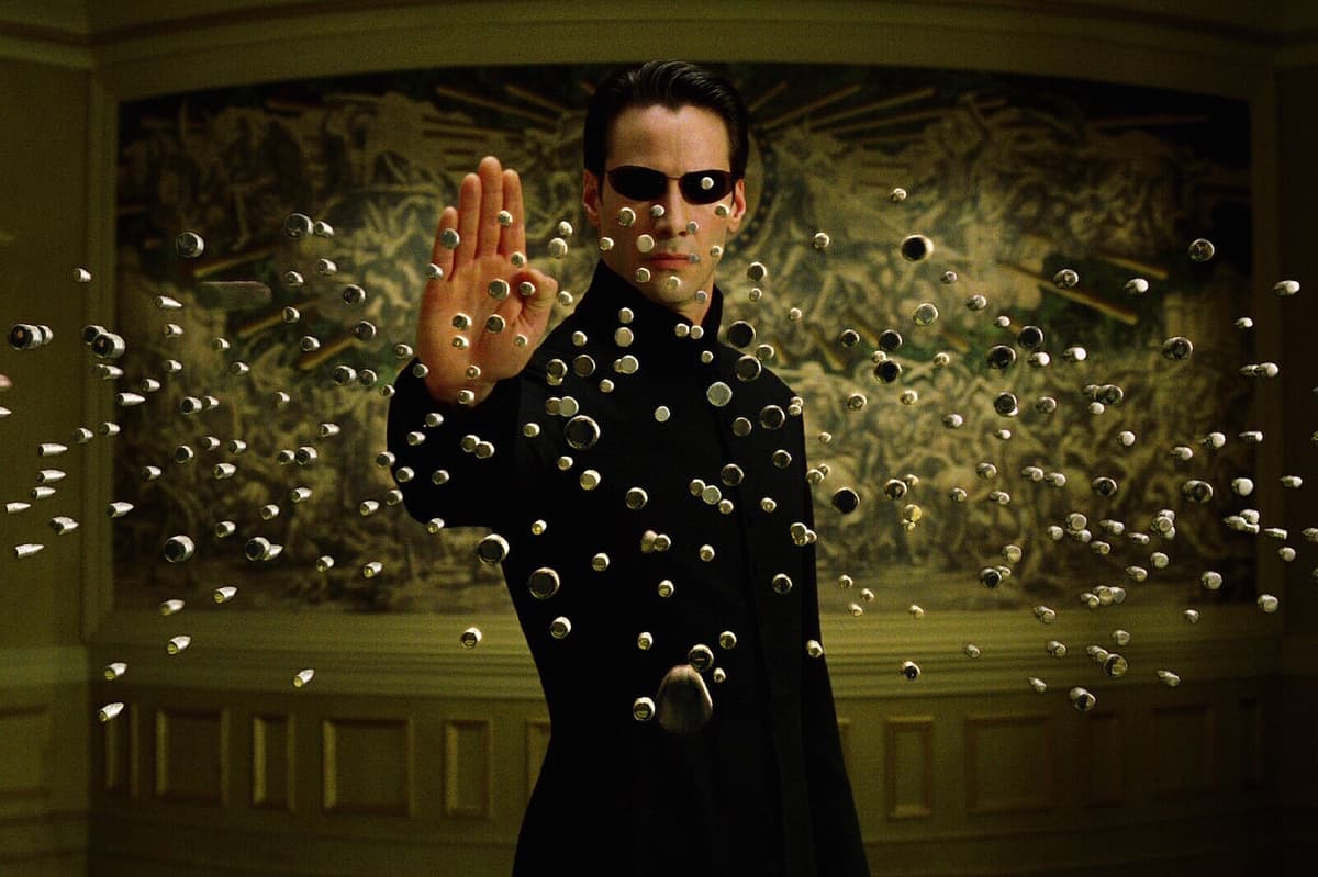 Keanu Reeves as Neo stopping bullets in The Matrix Reloaded