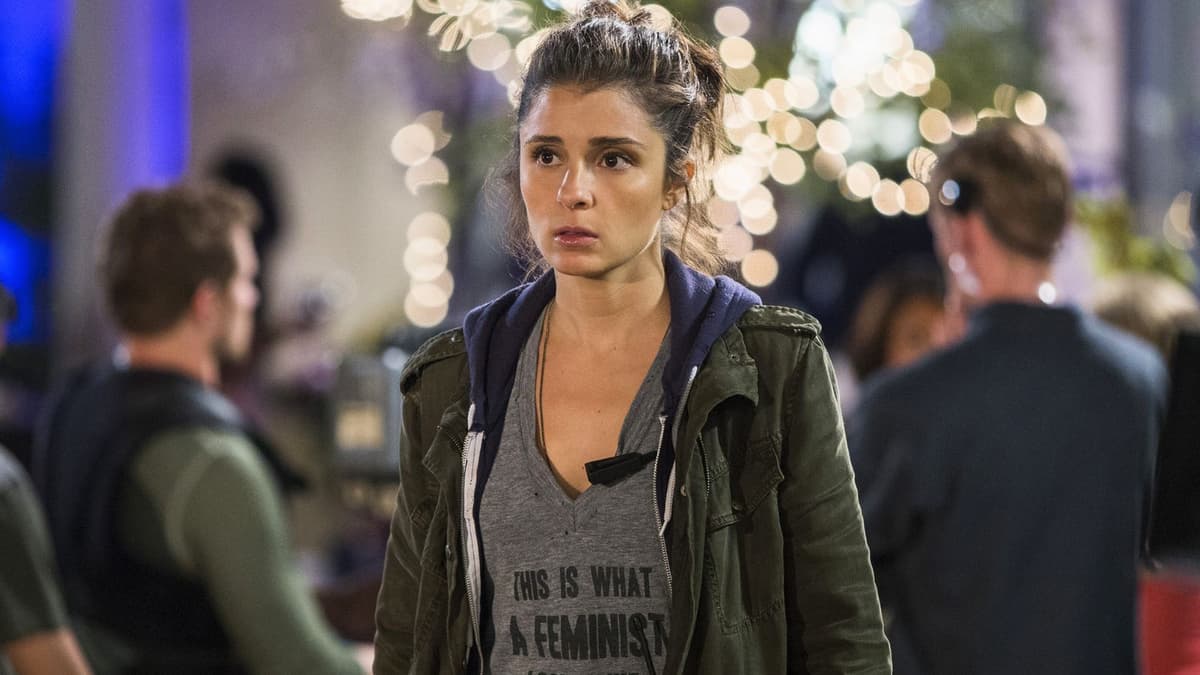 Shiri Appleby wearing a feminist slogan shirt on UnREAL.