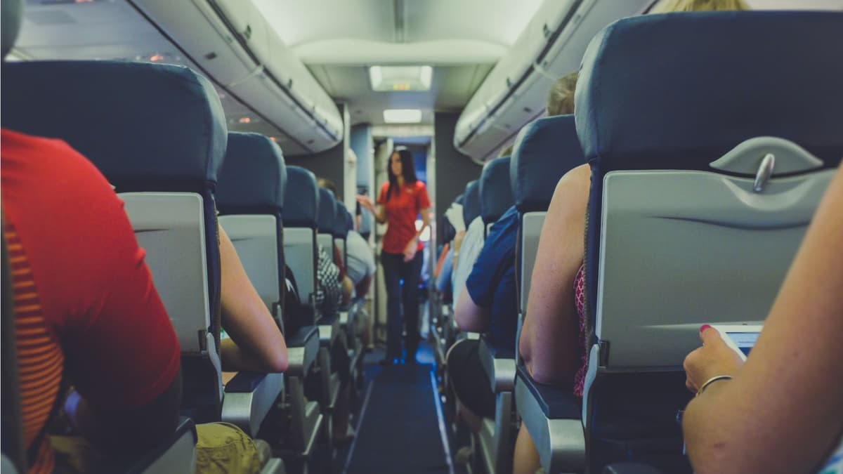 The aisle of a fully booked plane