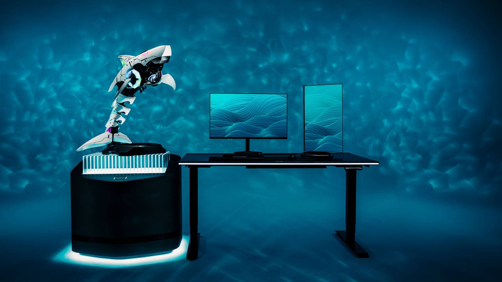 Promotional image of the Shark X PC next to a standard sized monitor.