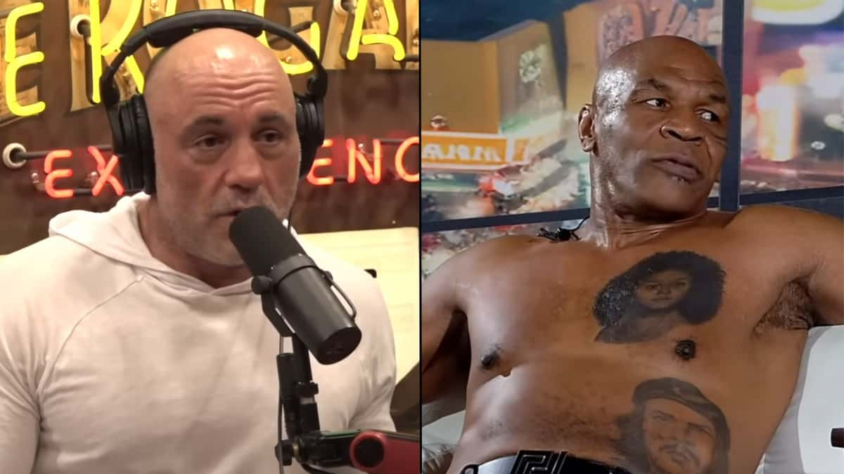 Joe Rogan talking into mic next to Mike Tyson sat on couch shirtless