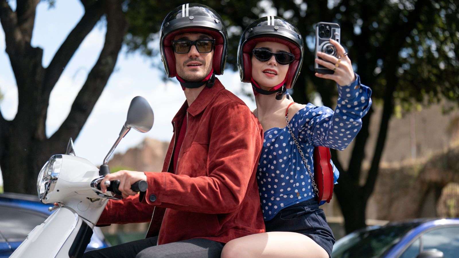 Emily and Marcello on a scooter in Emily in Paris