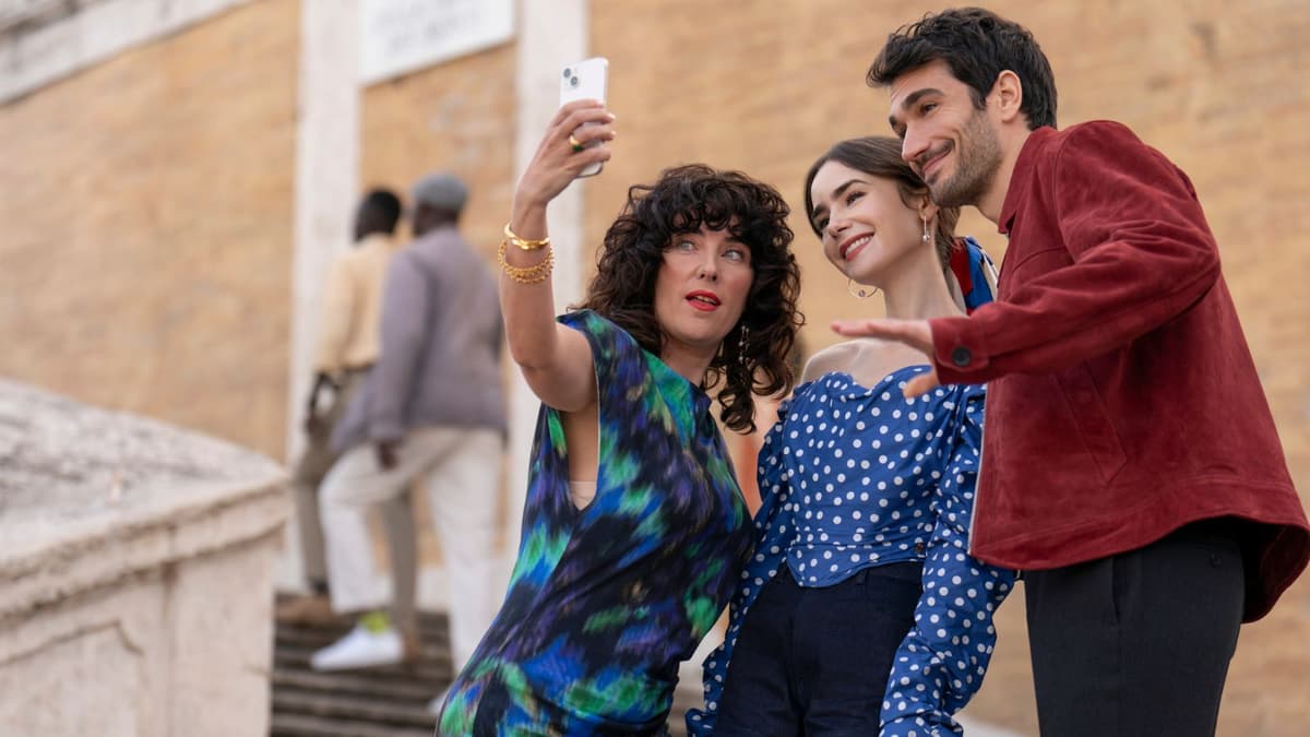 Emily, Marcello, and a Bavazza client take a selfie in Emily in Paris