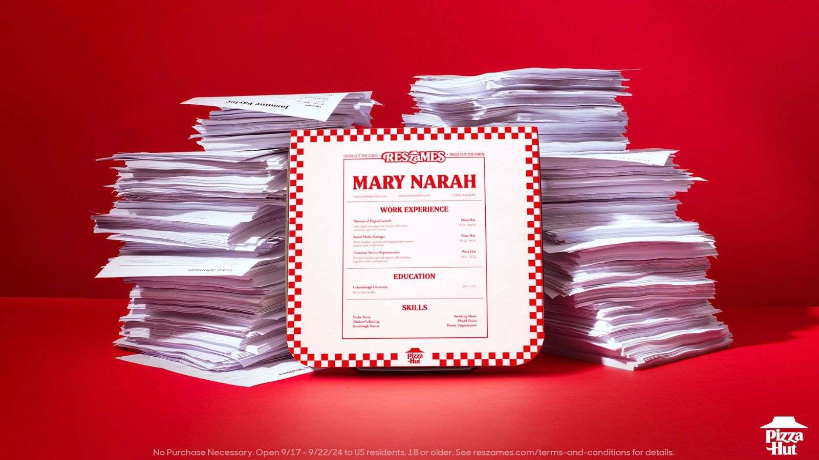 A pizza hut pizza box with a resume for Mary Narah on the front