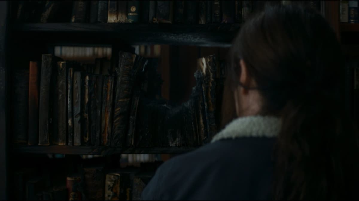 A charred book stack in Agatha All Along