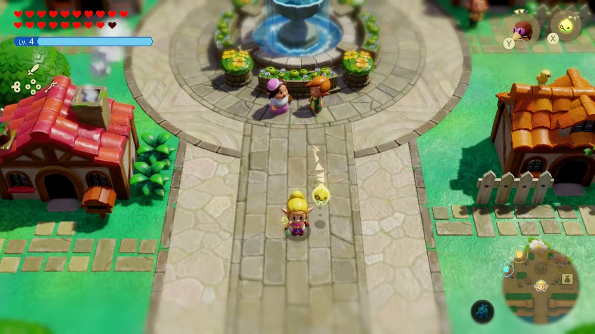 Zelda standing next to a water fountain