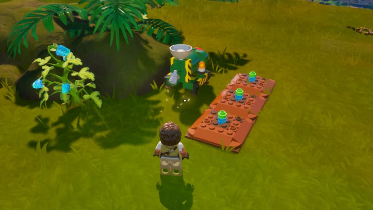 A screenshot featuring Klomberries planted in a garden in LEGO Fortnite.