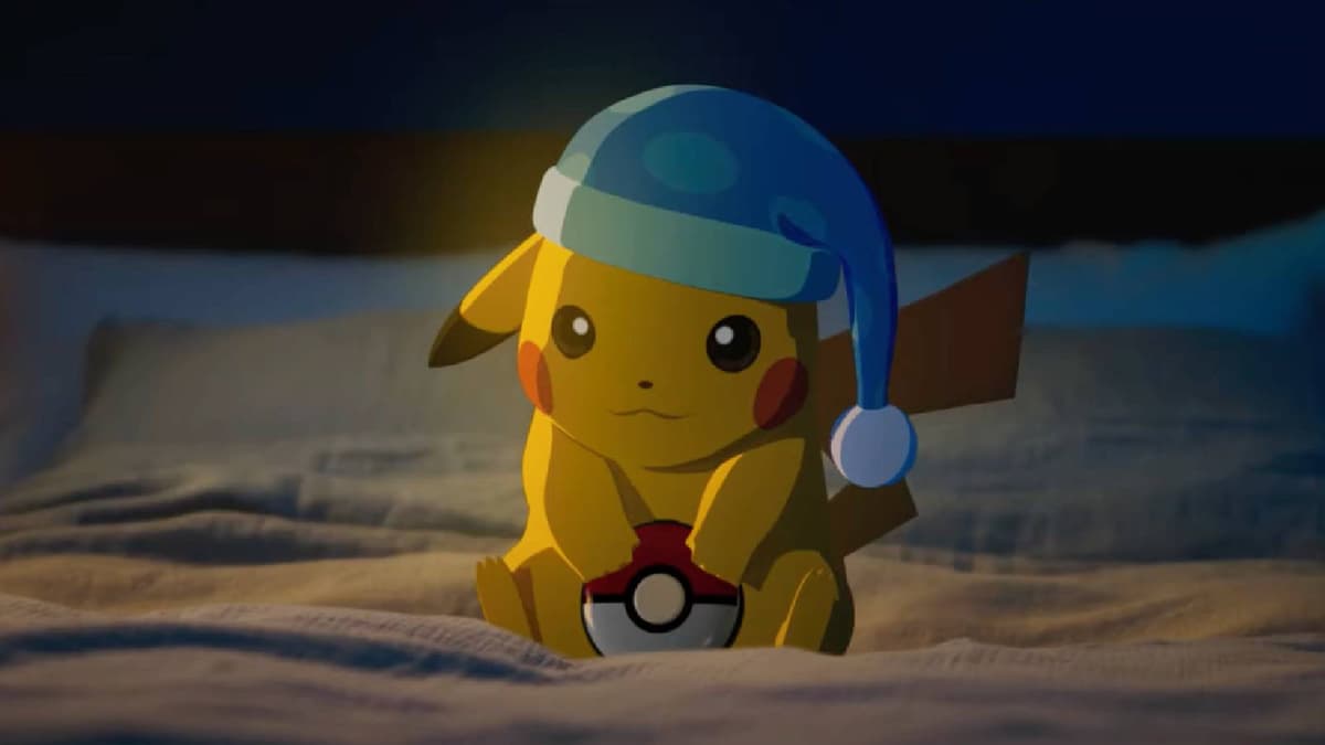 Pikachu sits on a bed with a sleeping cap and holding the Pokemon Go Plus+