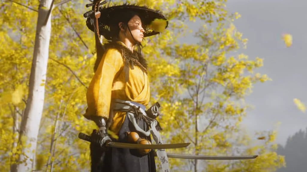 Atsu holding two katanas next to Gingko trees