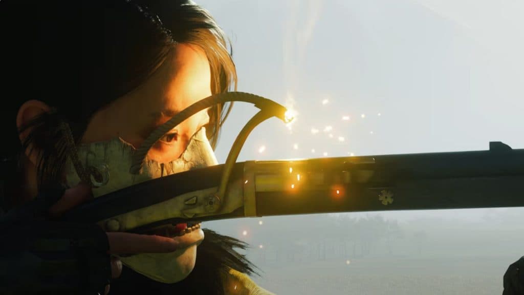 Close up of a woman firing a Matchlock Rifle