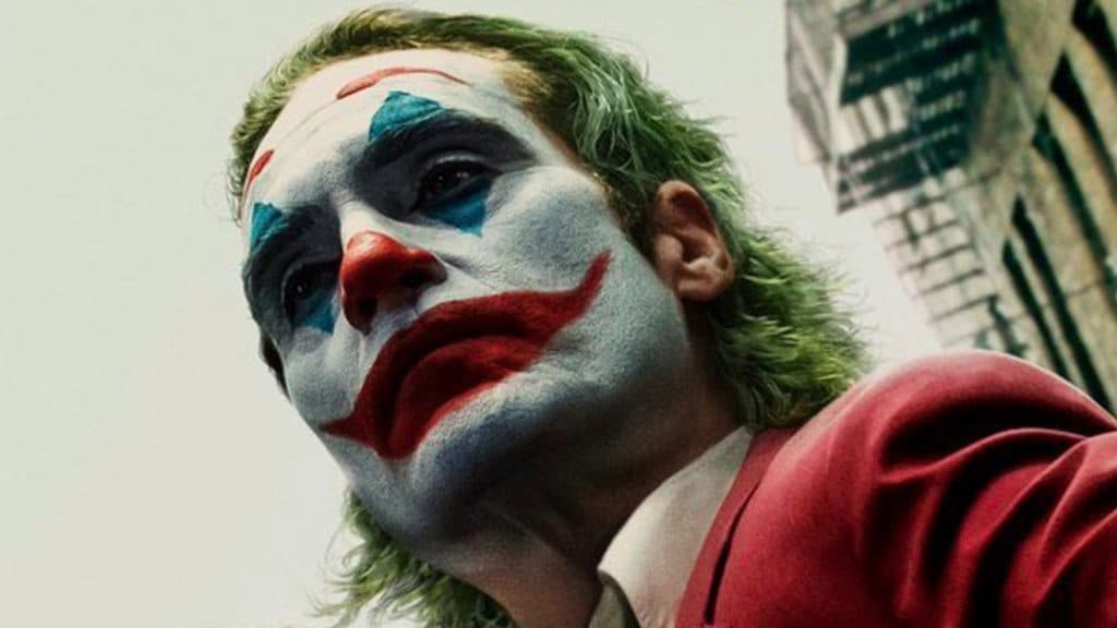 Is Joker 2 streaming? How to watch - Joaquin Phoenix as Joker in a red suit with clown make up