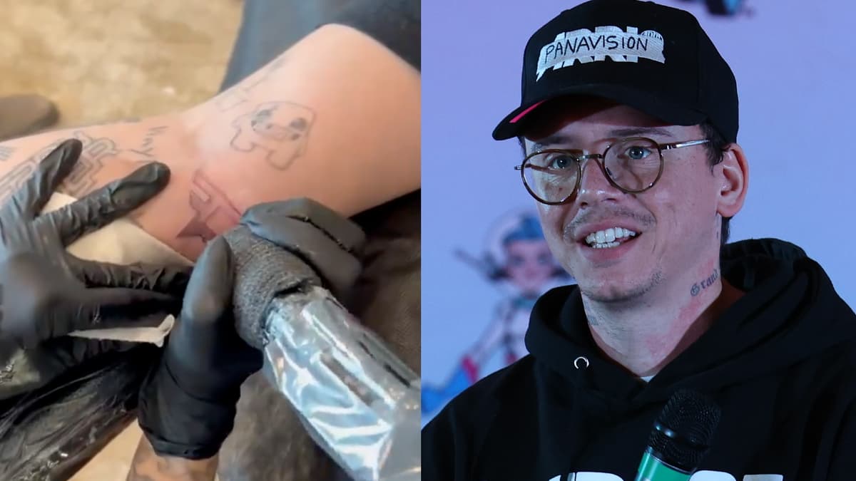 Picture of Logic at GalaxyCon next to image of Logic's FaZe Clan arm tattoo