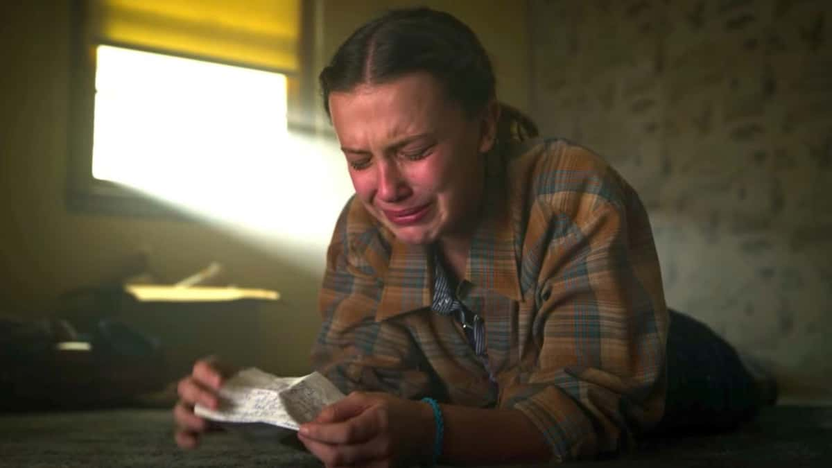 Stranger Things Season 5: Millie Bobby Brown as Evelen, crying on the floor in Stranger Things