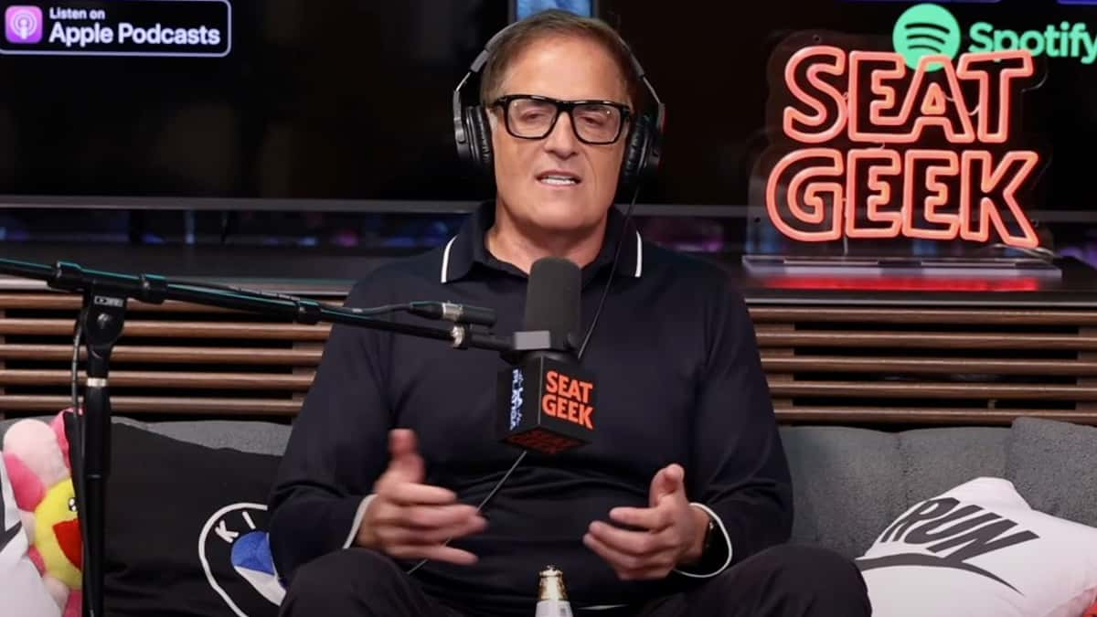 mark cuban sitting on a couch talking into a microphone