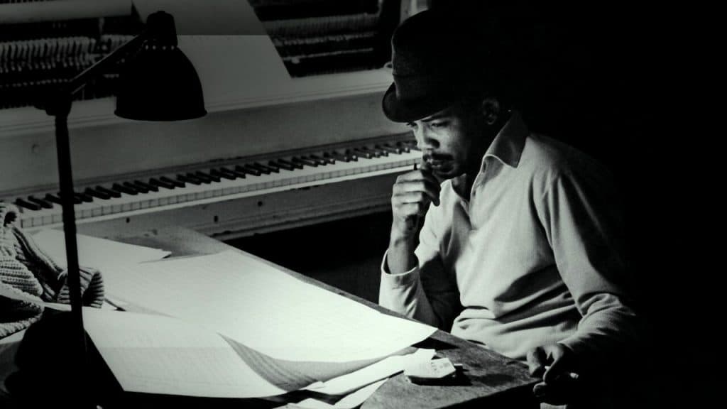 How to watch the Quincy Jones documentary: Young Quincy Jones at a desk